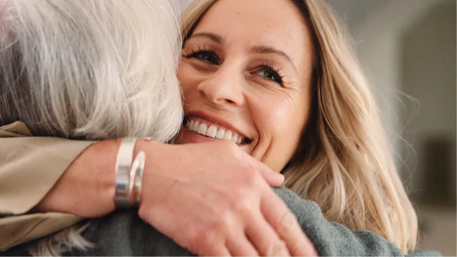 A daughter hugging her mother