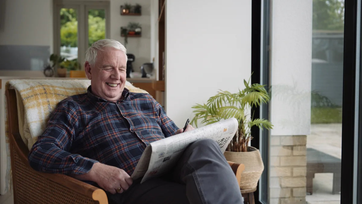 A loved one enjoying the newspaper at home